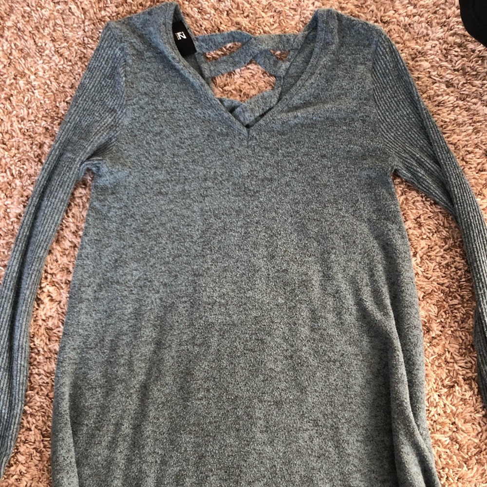 A cute long sleeve cut in the back sweater